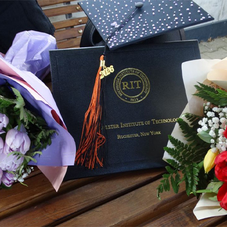Students at a graduation, in their caps and gowns.