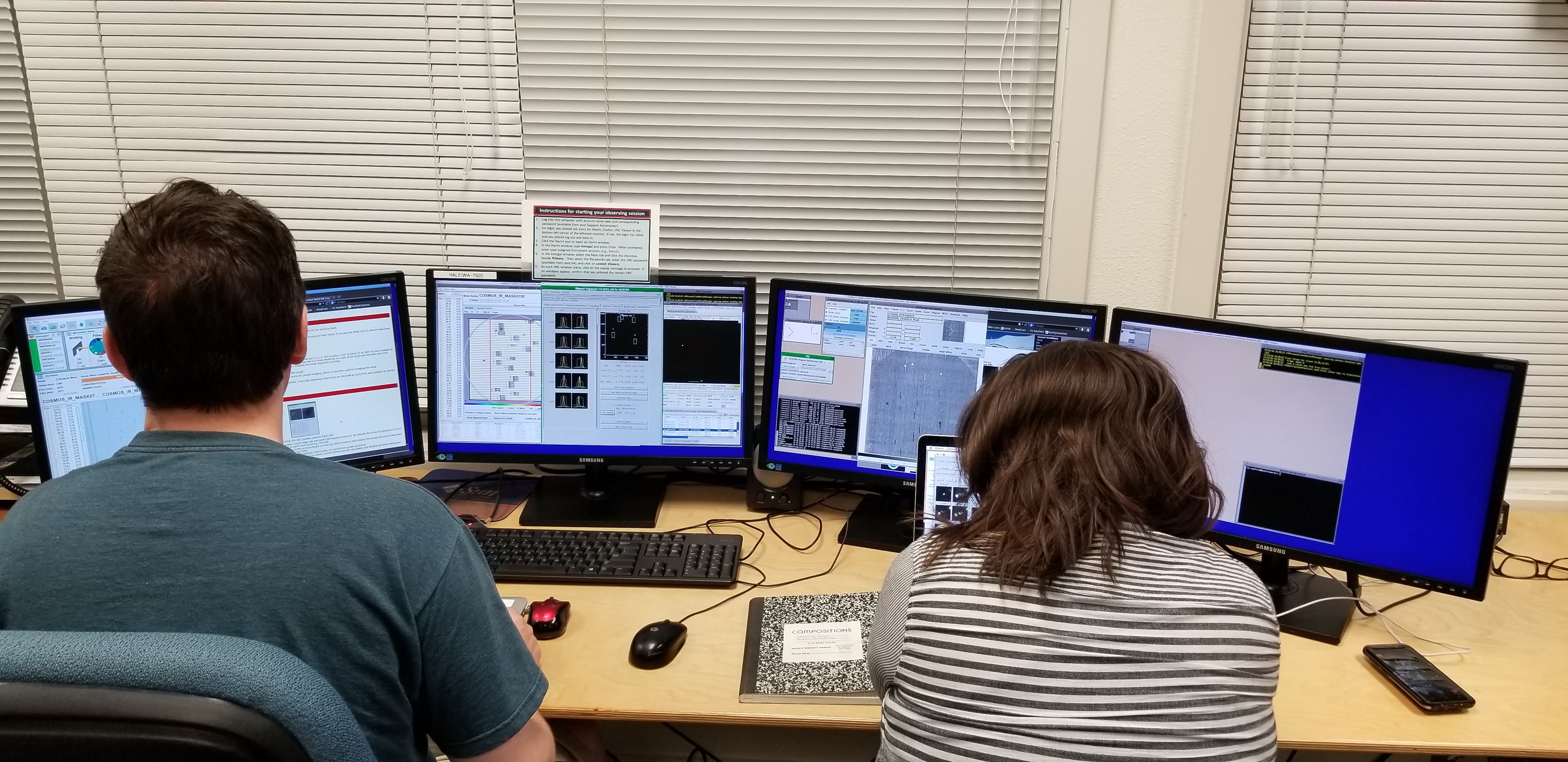 Graduate students Kevin Cooke and Brittany Vanderhoof observing at the Keck I telescope using the MOSFIRE instrument in February 2018.