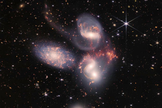 three galaxies in space.