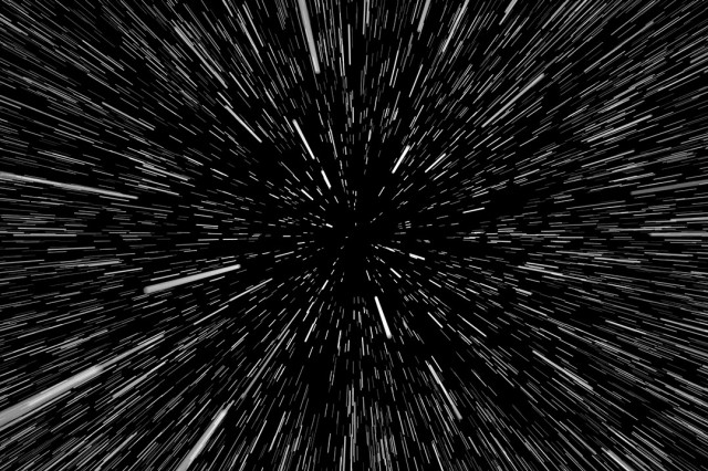 field of stars depicted as streaks radiating from the center of the image as if you are traveling at warp speed.