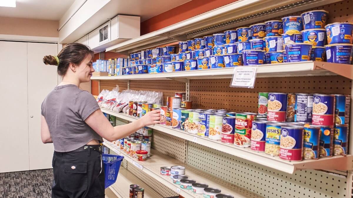 A volunteer at FoodShare restocking the shelves
