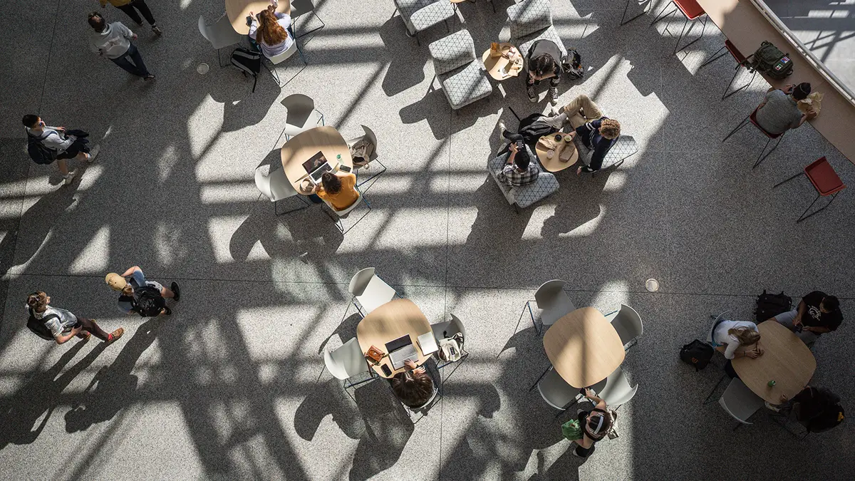Overhead view of people sitting in an atrium.
