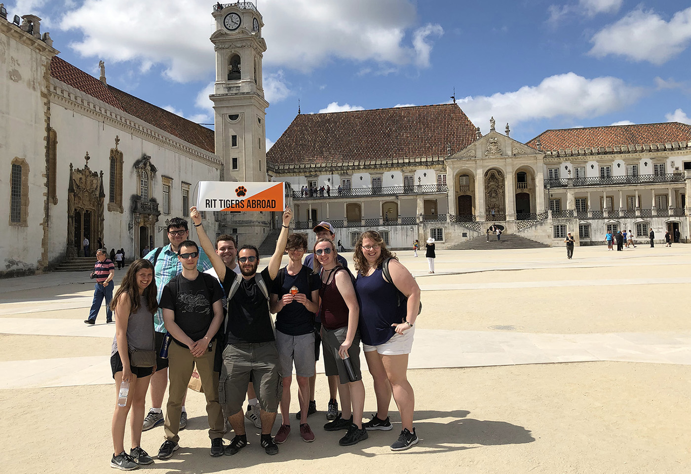 Students in Portugal on Study Abroad holding RIT sign