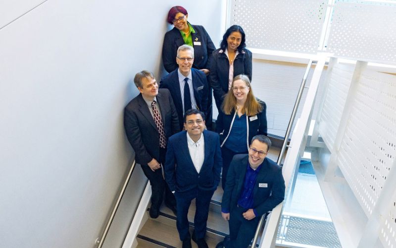 a group of researchers in the stairwell for portrait