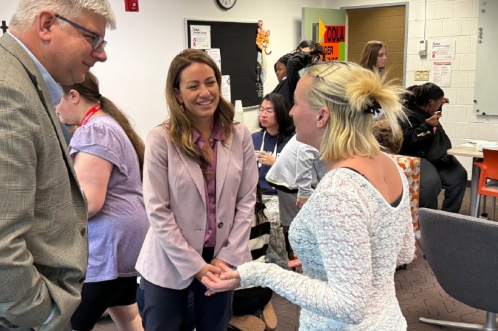 the president an dean talk with students at donuts with the dean 
