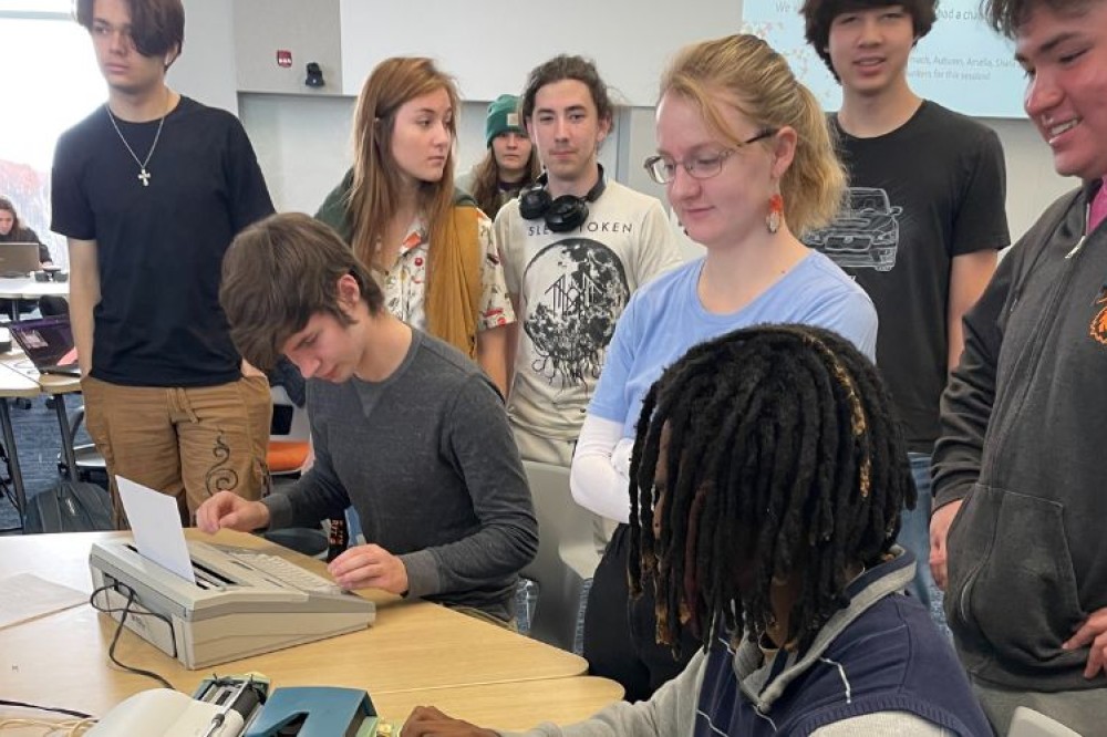 a group of students using typewriters for the first time