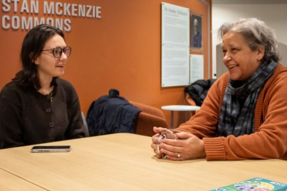 dean and student at breakfast