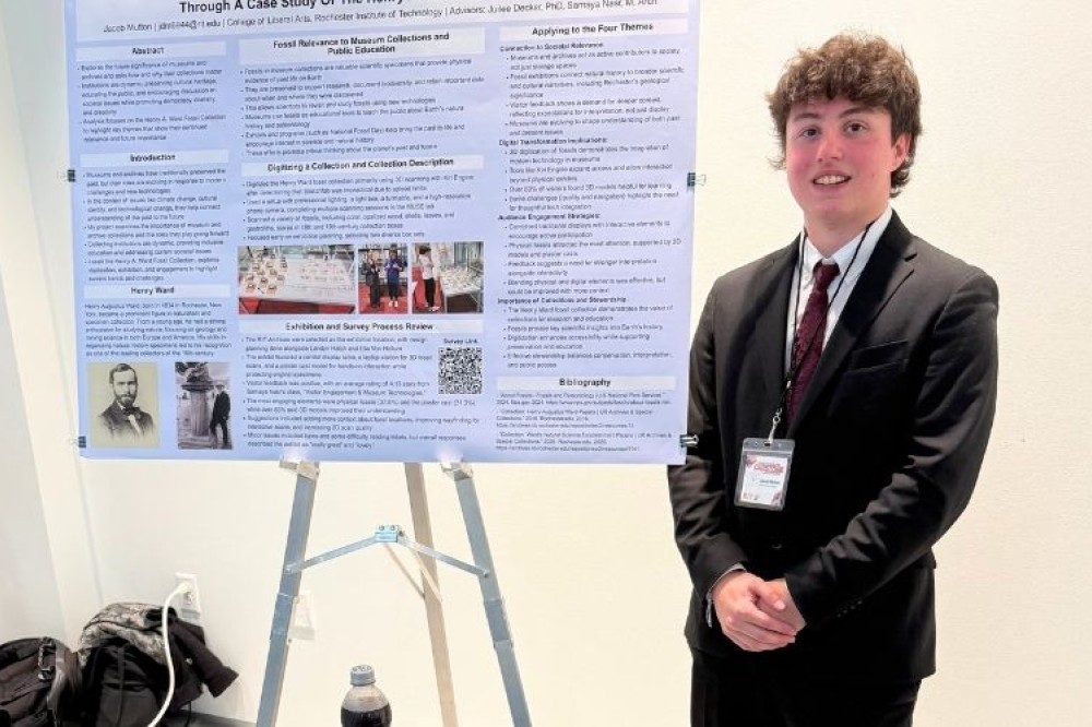 a student presenting his capstone at the conference