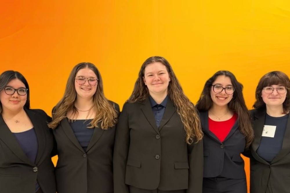 the five students who competed posed for a group photo