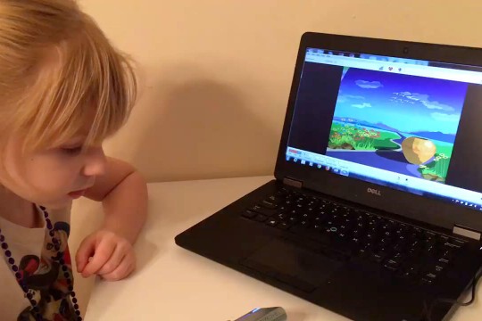 Biofeedback testing on computer with young child.