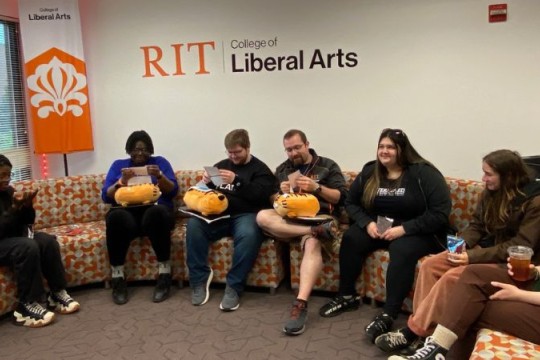 A group of students in the liberal arts hall lounge 