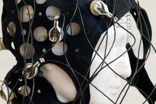 a photo of a cap with electrodes that is used to measure brain activity