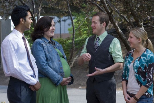 Professors and Students talking at event