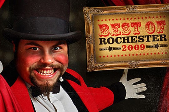 Person pointing to "Best of Rochester: 2009" sign