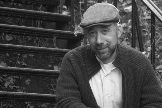 Person posing for camera on steps