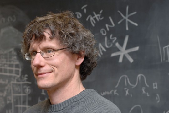 Professor standing in front of blackboard