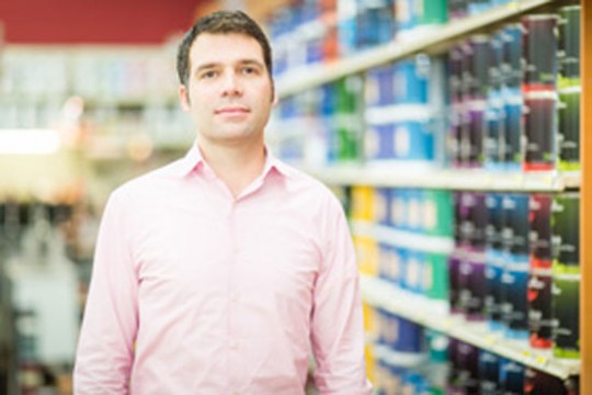 Professor posing for camera in store