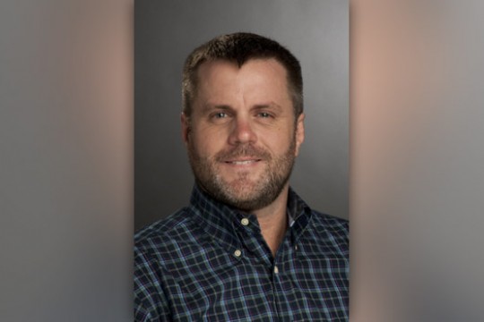 Professor posing for camera