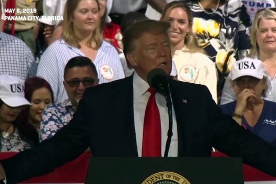 President Trump speaks at podium.