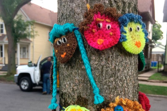 Yarn creatures on a tree