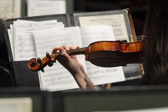 woman playing violin.