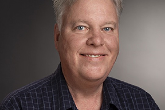 Professor posing for camera