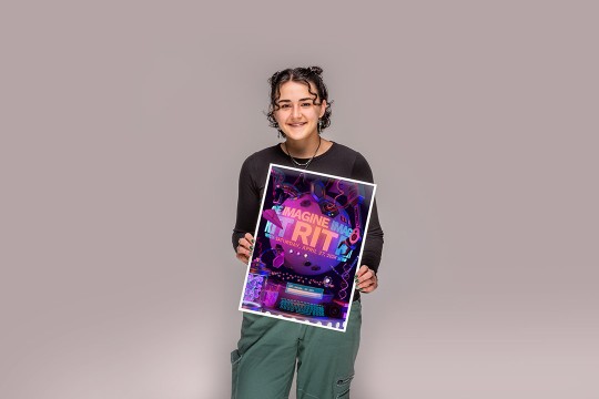 Jessica Hall holds her winning poster design for this years Imagine RIT Creativity and Innovation Festival