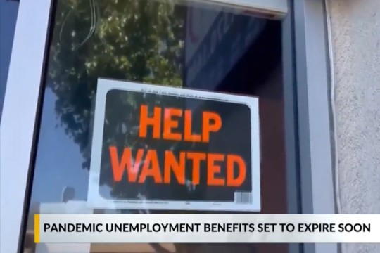 help wanted sign in a window.