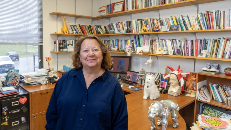 Professor Deborah Blizzard stands in her RIT office