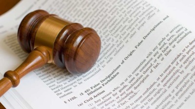 A gavel resting on an open book