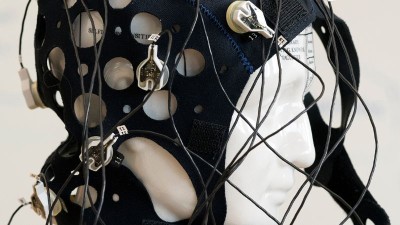 a photo of a cap with electrodes that is used to measure brain activity