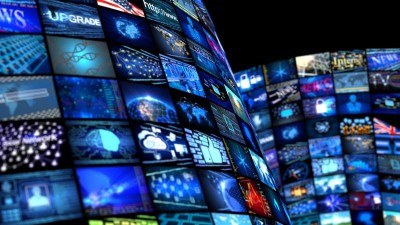 an image of lots of digital screens showing news and media and communication