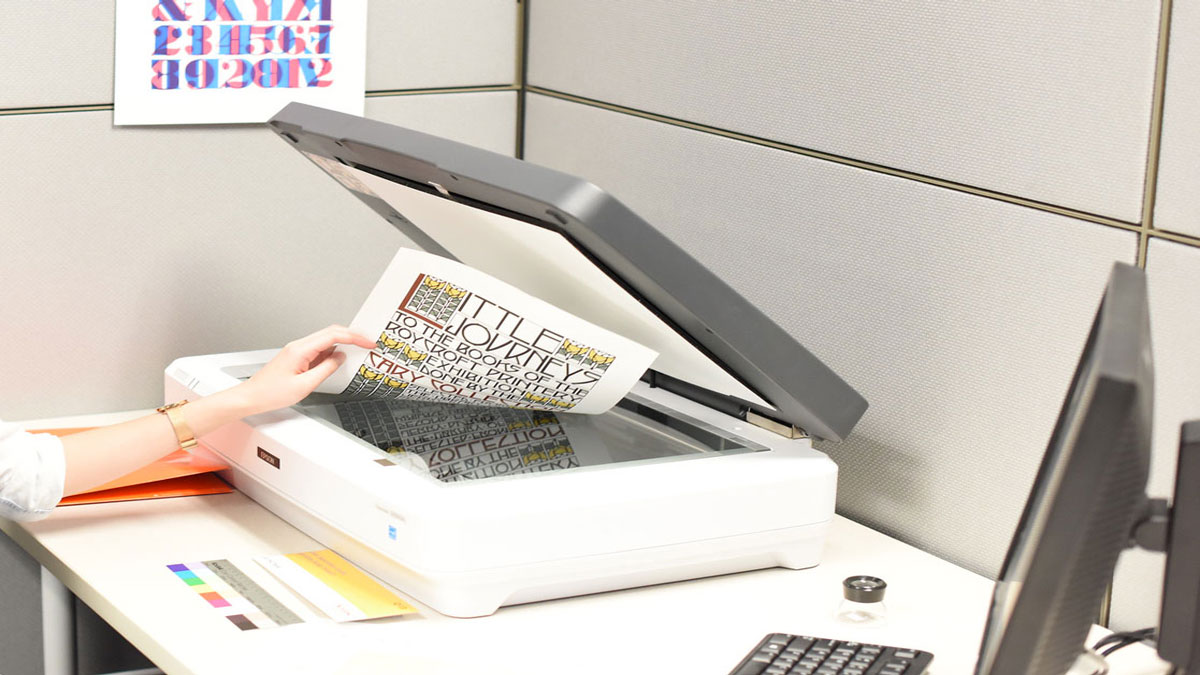 A student photocopying a piece of paper with specific fonts