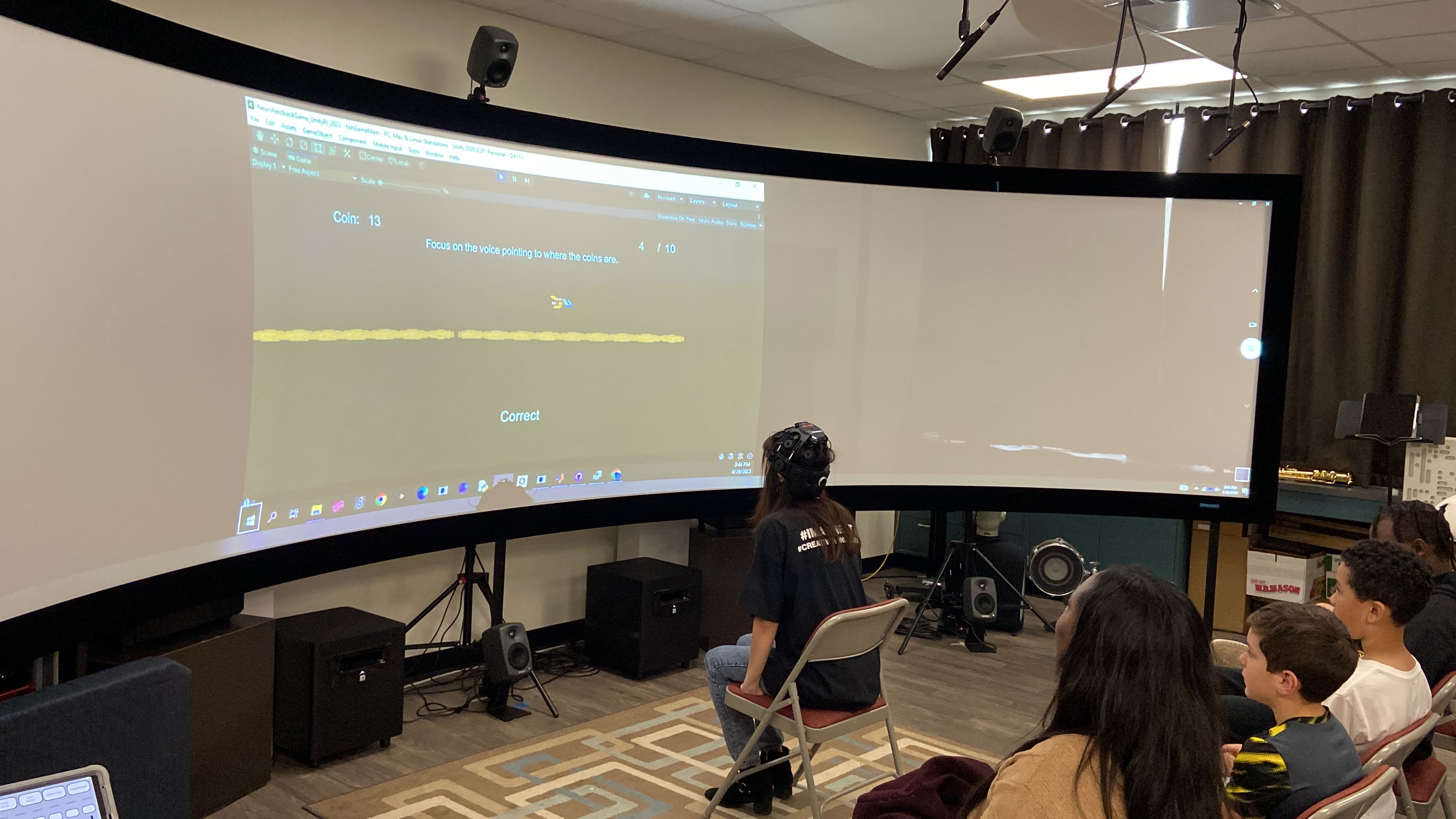 Maria Tanetani demonstrating the gamified auditory neurofeedback experiment