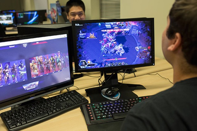 two students playing computer games.