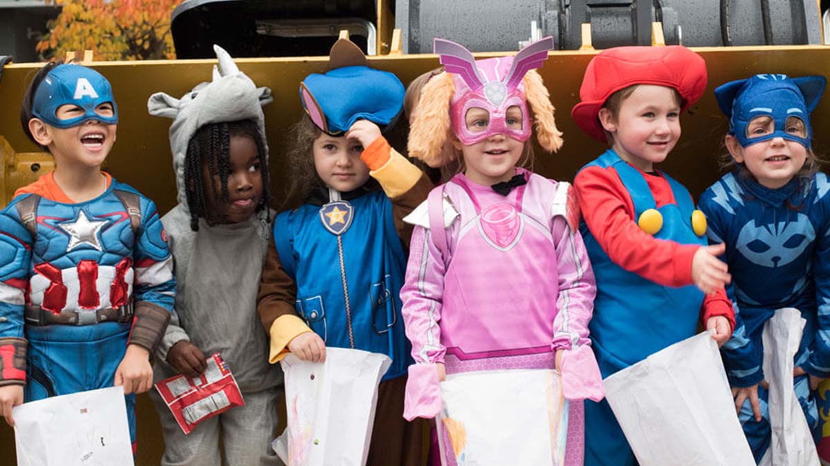 Group of preschoolers dressed in Halloween costumes.