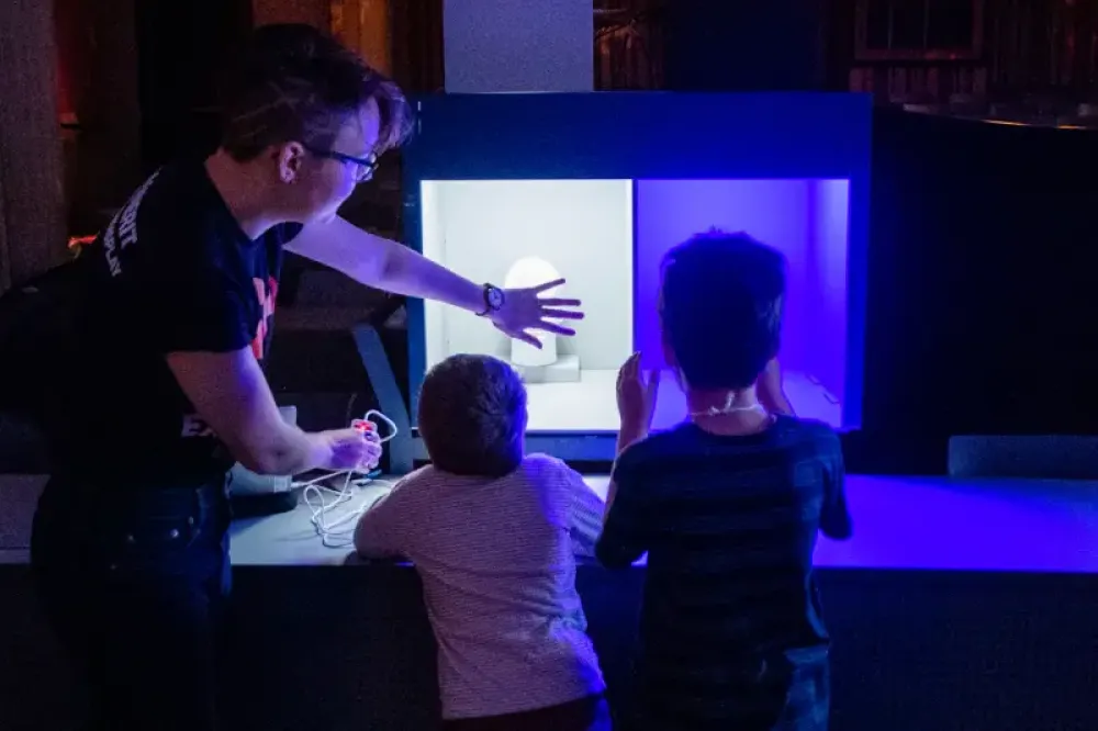 Someone with their hand over a light in a lightbox