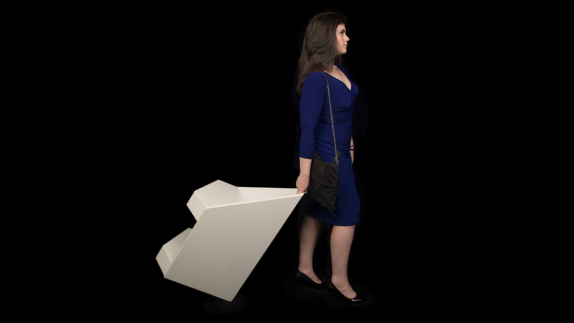 Women holding tipped chair in backward position showing lightweight and mobility 