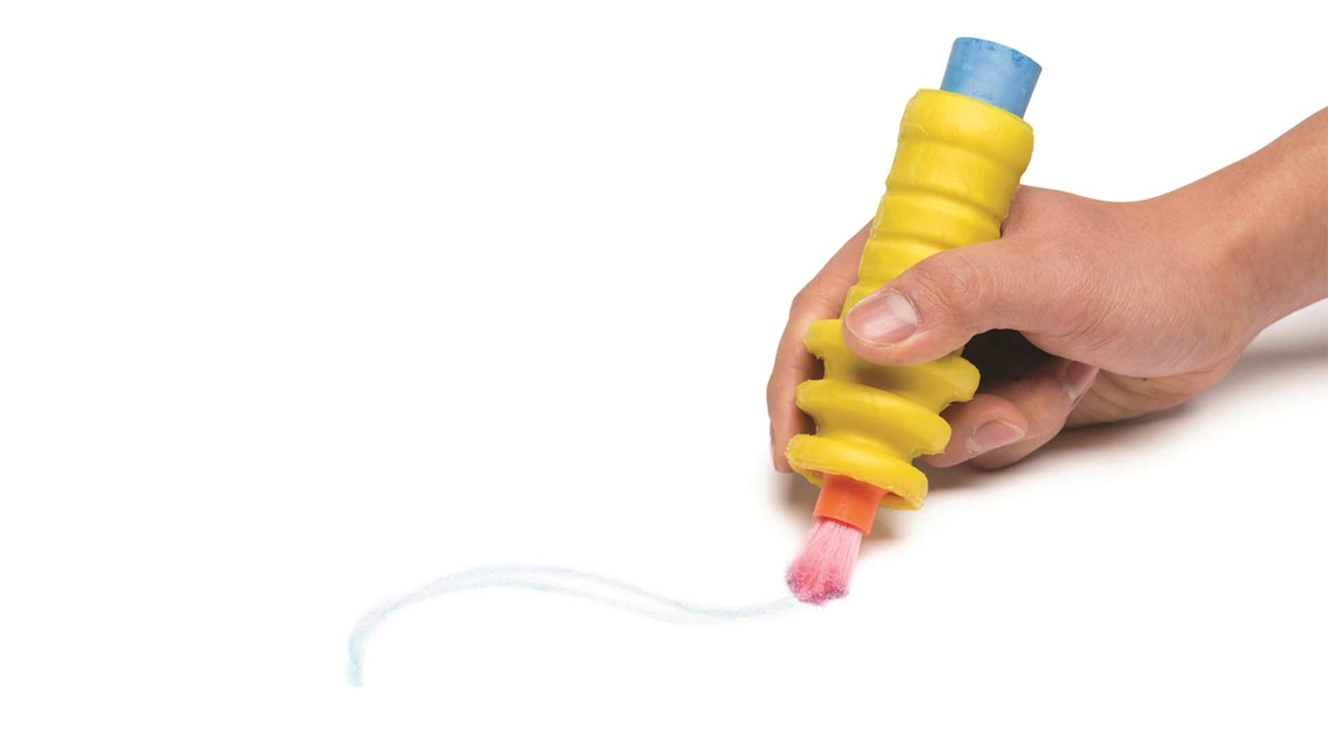 Someone brushing over blue chalk line with bristle end of holder to create effects