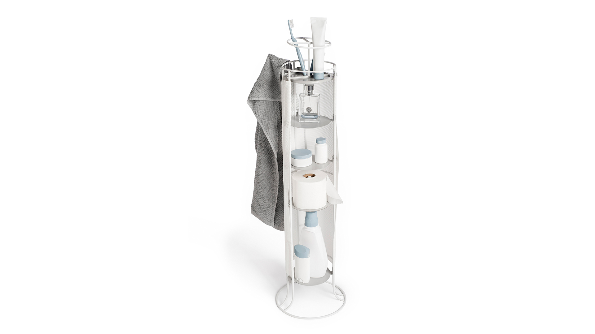 Tall white cylindrical tower with five accessible shelves with various bathroom supplies and towel hanging from side hook