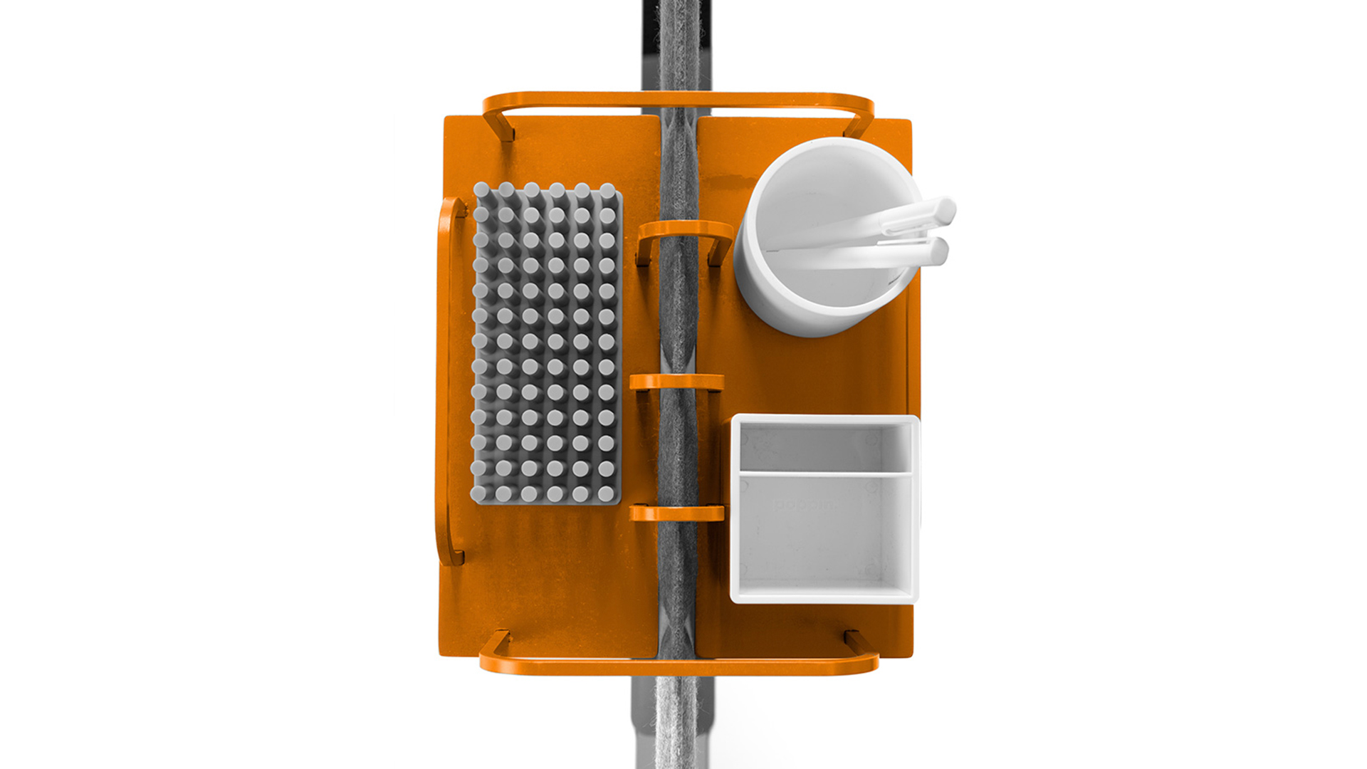 Storage caddy hung on wall divider beam with assorted accessories inside