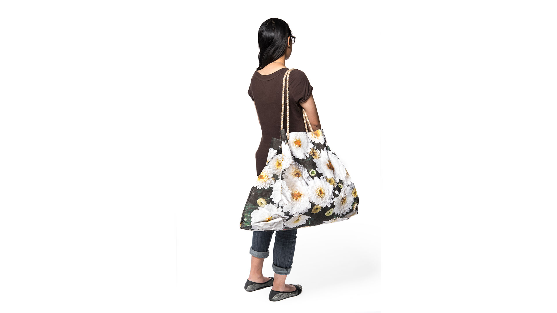 Student with large daisy bag over shoulder showcasing large size of bag
