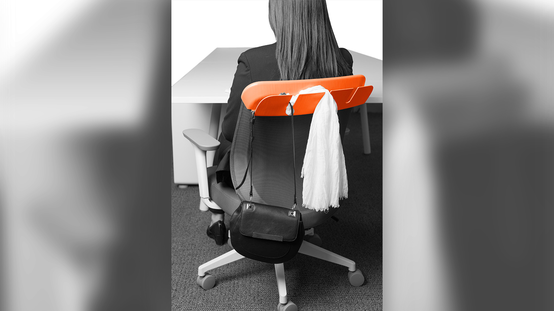 Desk chair overhang with slits for hanging scarf and handbag