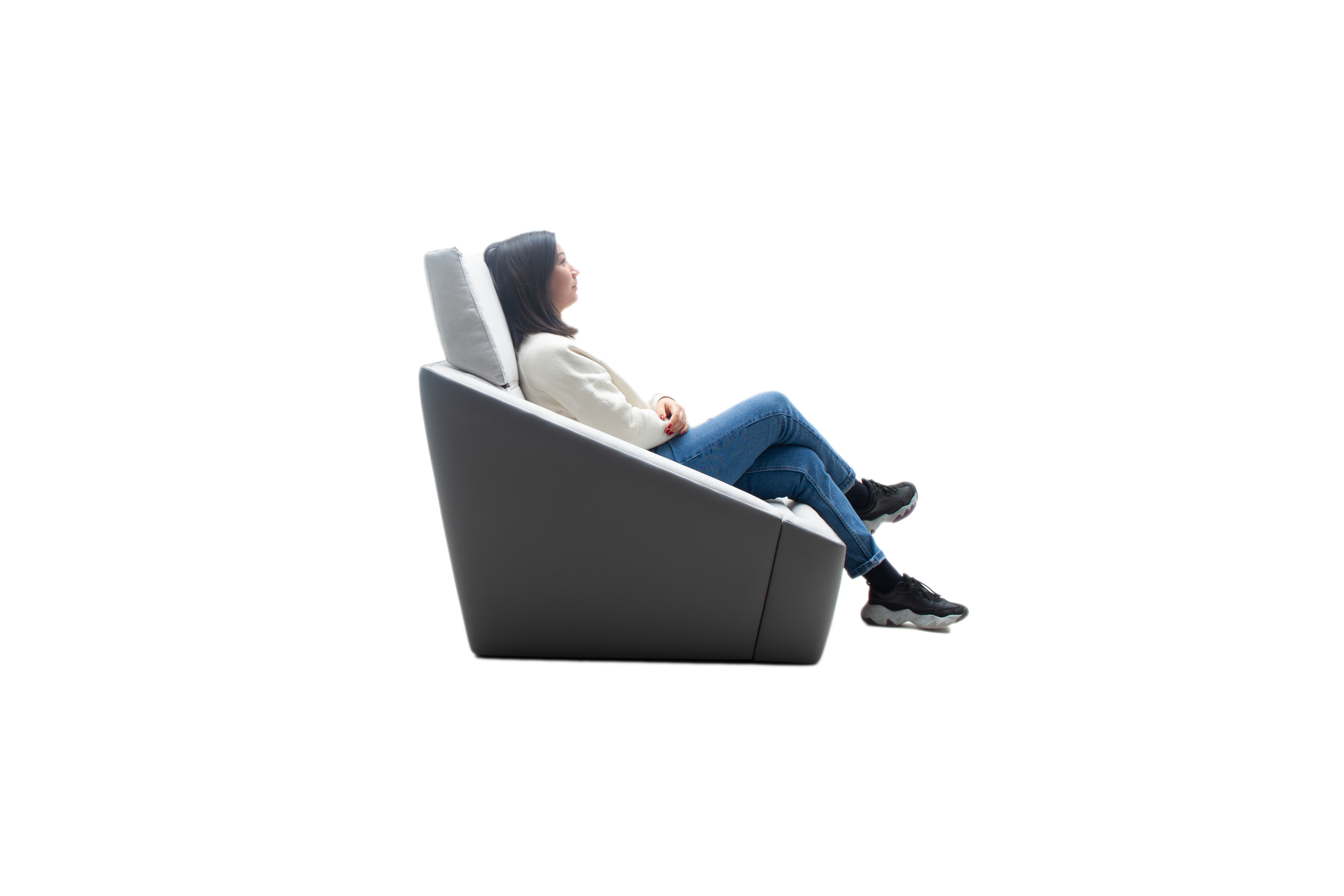 a person sit on the Shell Chair