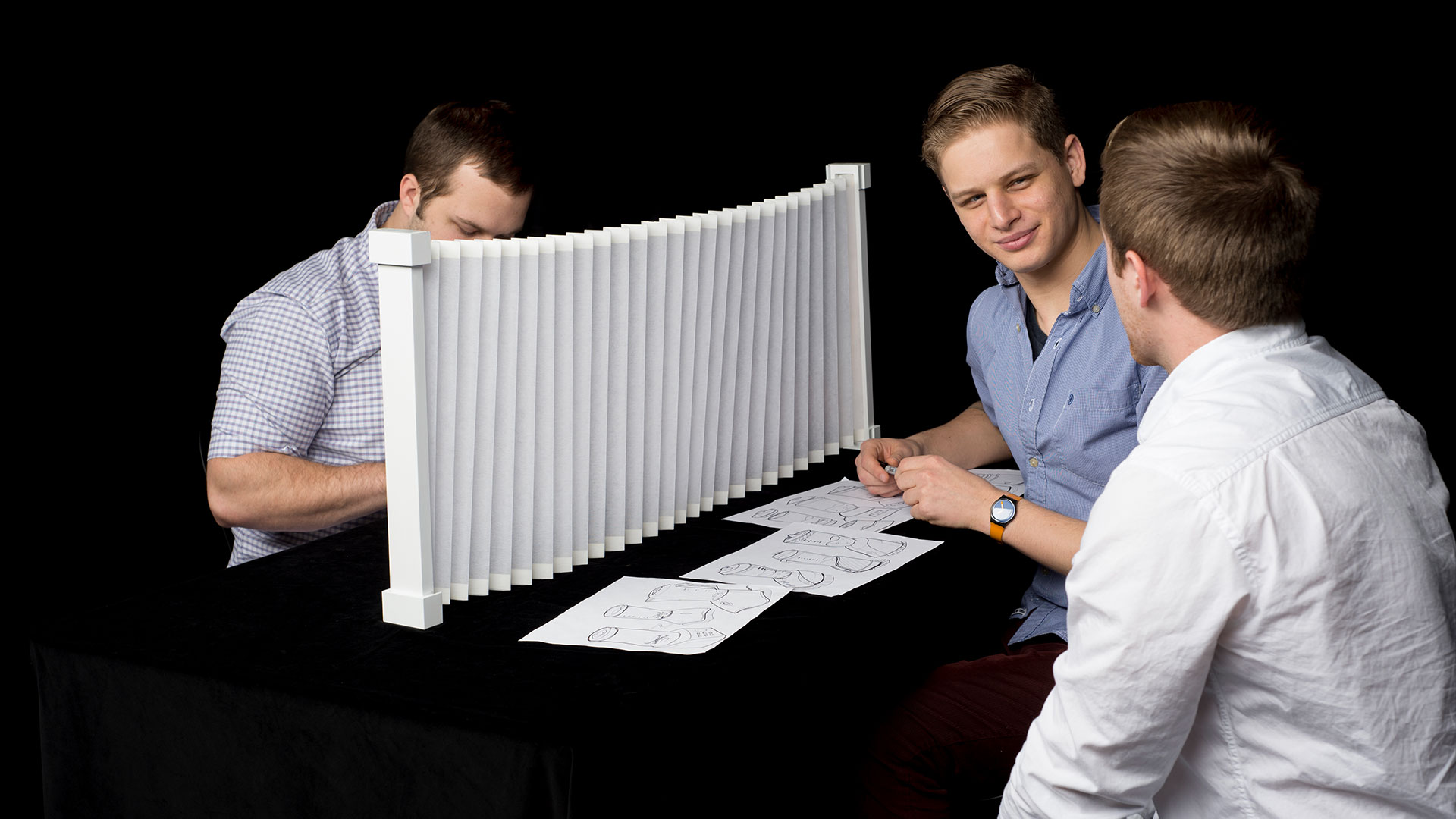 Mobile Divider fully extended into long accordion table wall for maximum privacy for students on either side of table