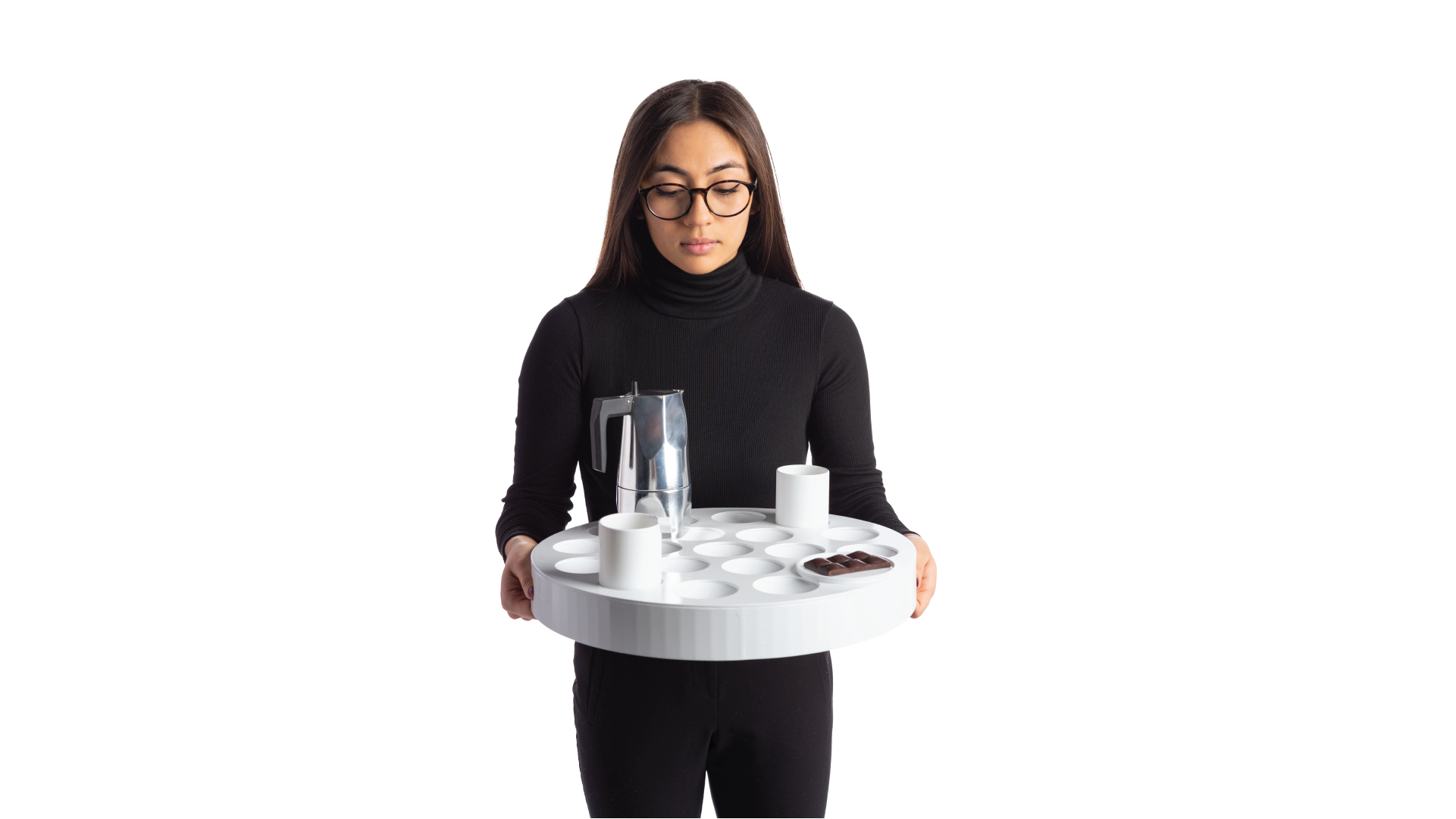 Person holding the coffee set with both of their hands. The set has two cups, a kettle and a tray with food.