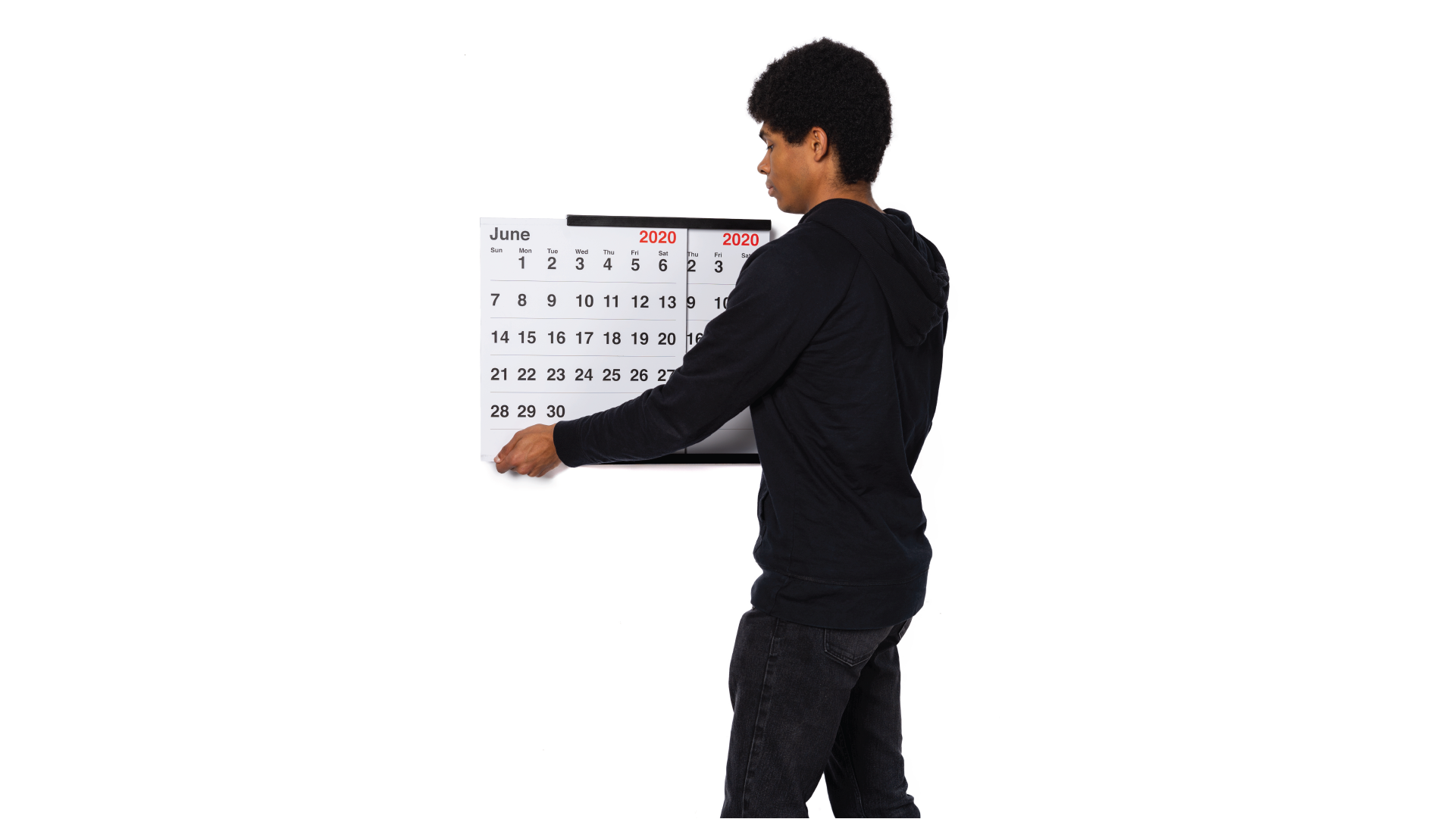 Person sliding the calendar through the black support to change the month.
