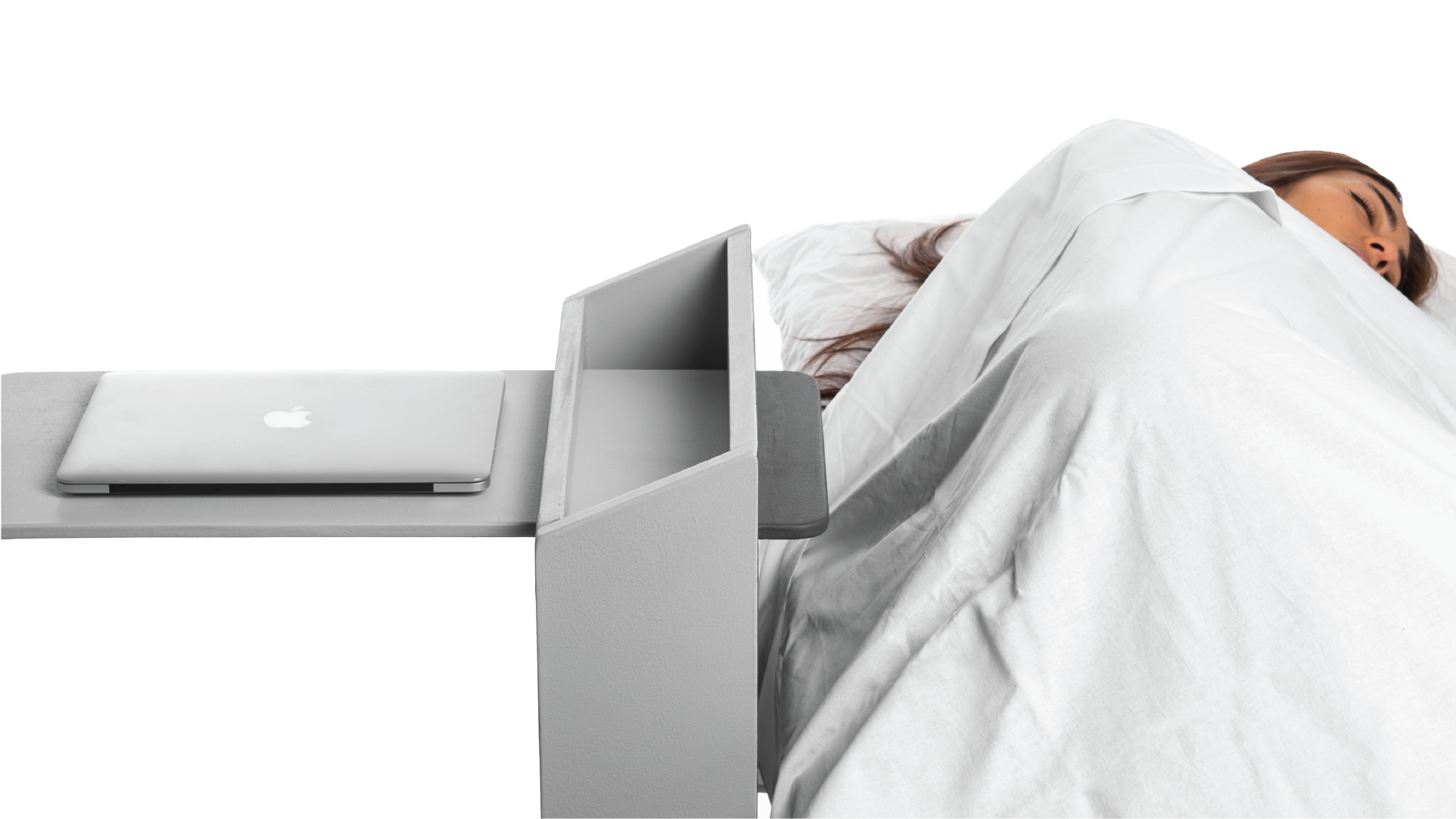 Person sleeping with the computer places on the convertible bedside.