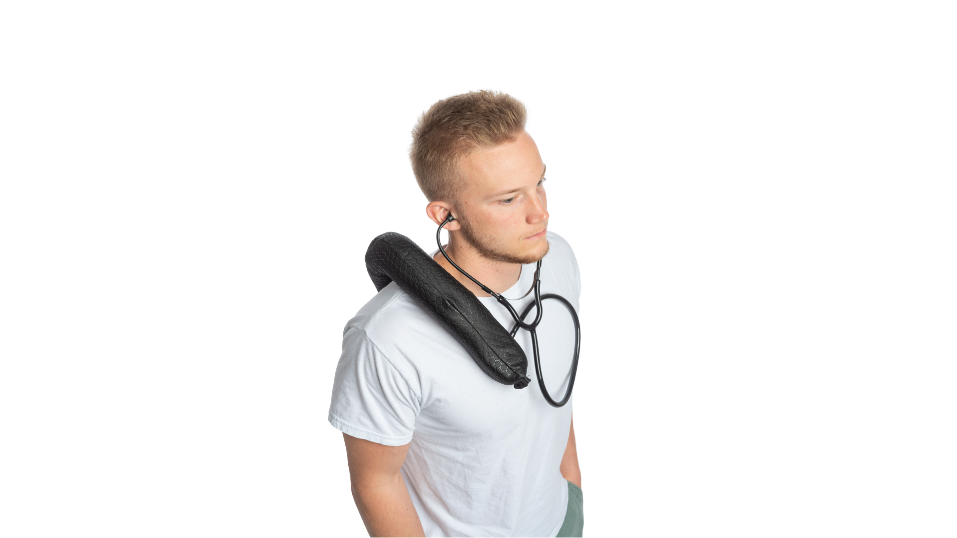 Person listening their heartbeats through the black wearable bag linked to the stethoscope.