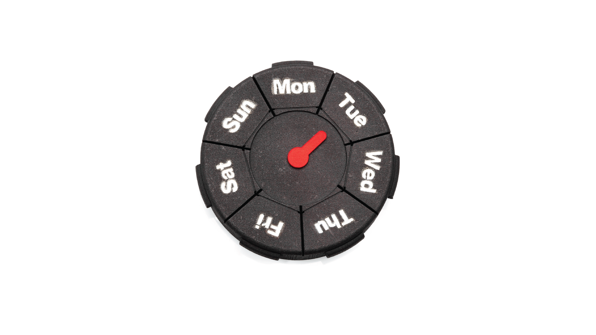 Pill case in a circular shape with the seven days of the week placed around. In the middle of the case, there's an indicator for what day of the week is today.